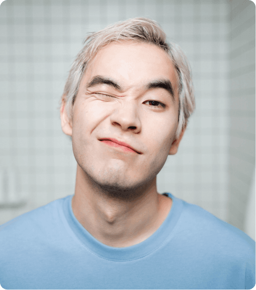 Man in blue shirt winking